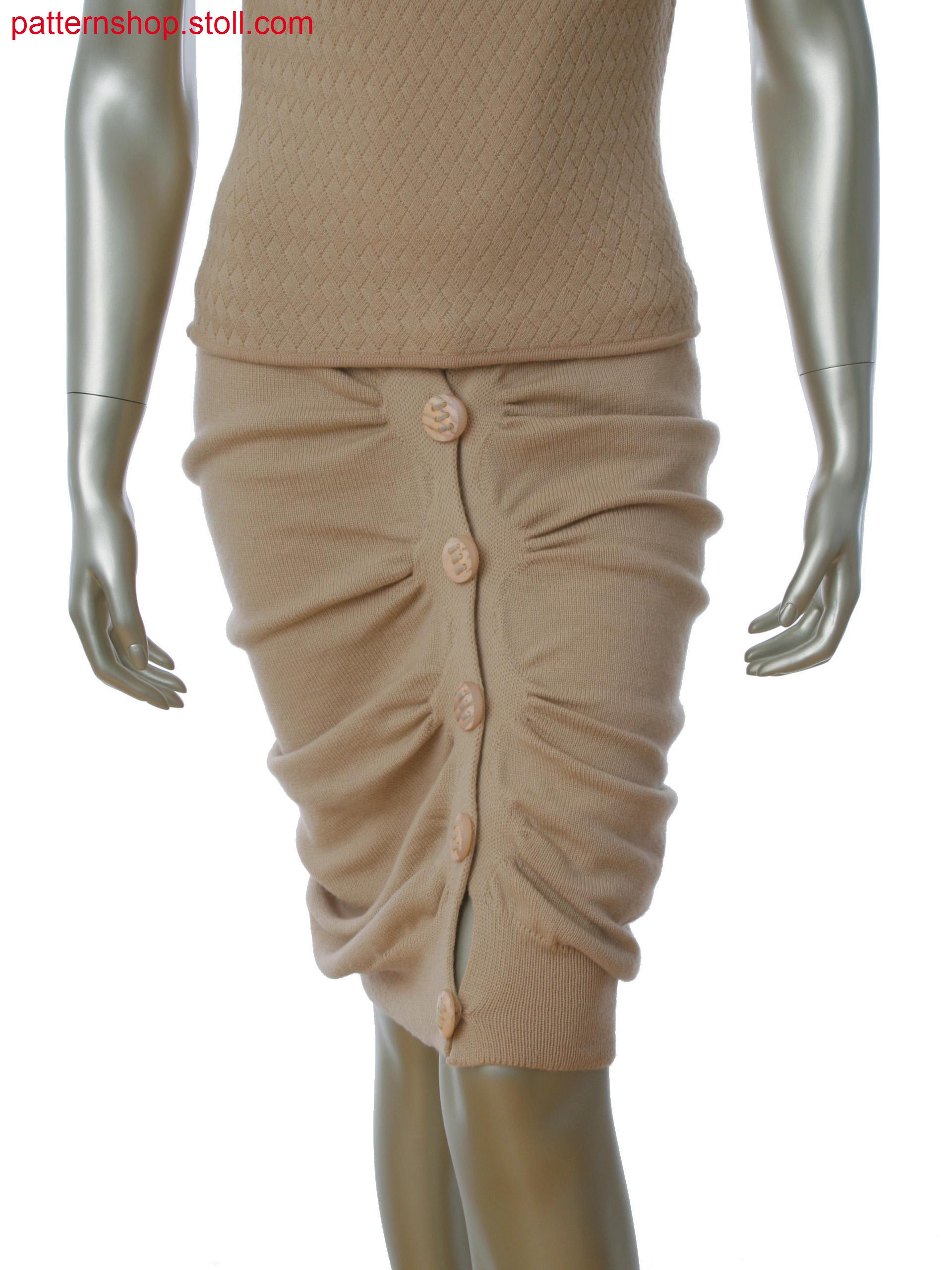 Seamfree gathered skirt in single jersey, tubular and alternate knitting with integral button holes.